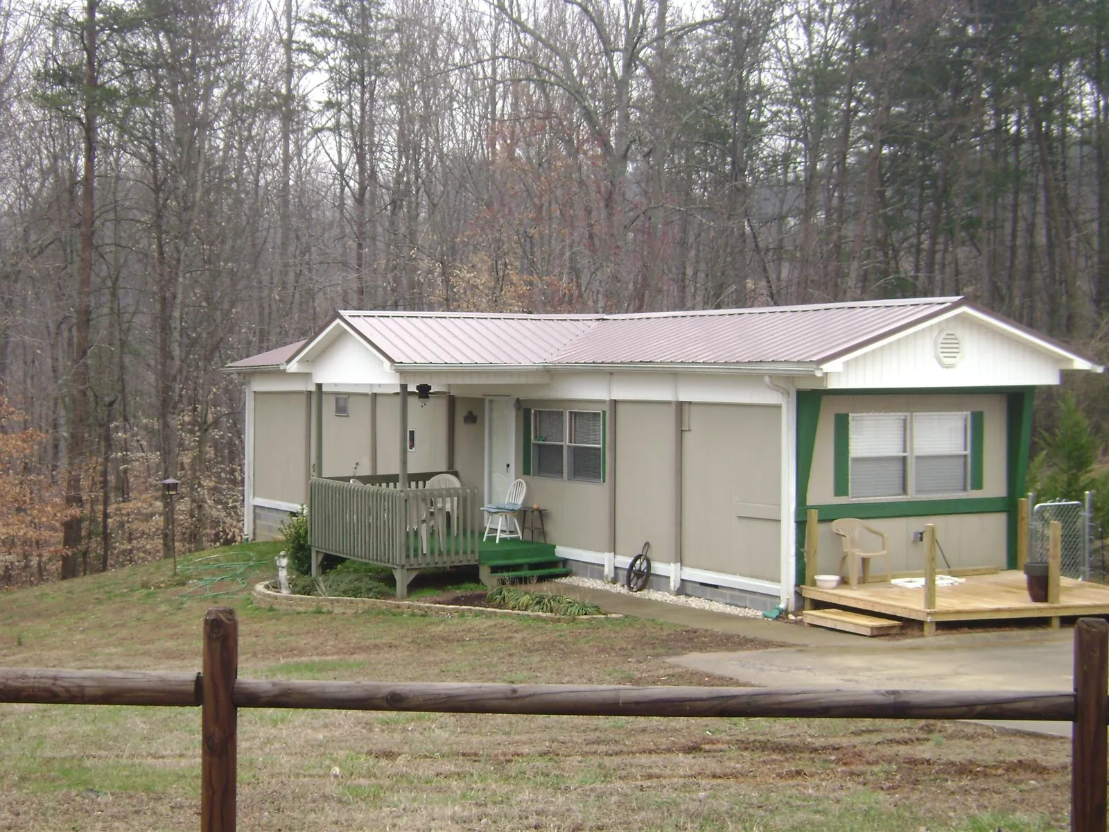 Mauve metal roof on a manufactured home with a new front deck in Poulsbo